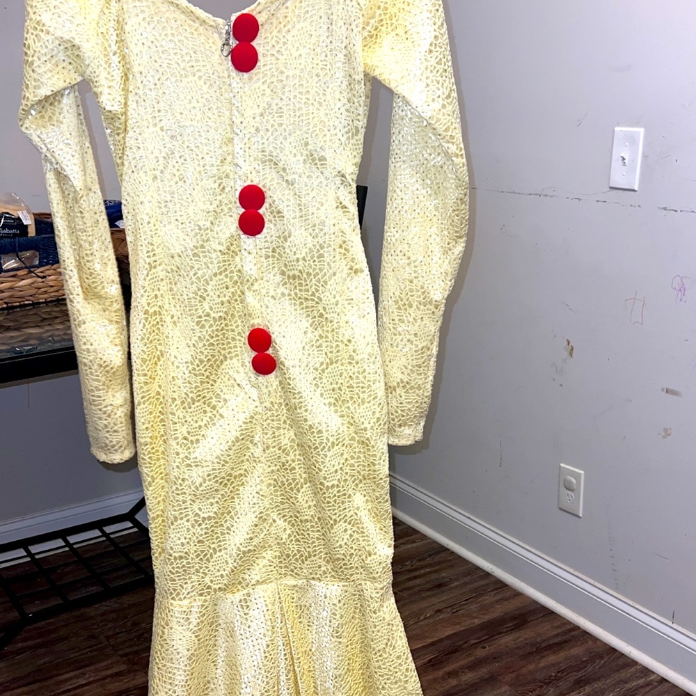 Evening gown. Yellow with red decorative buttons